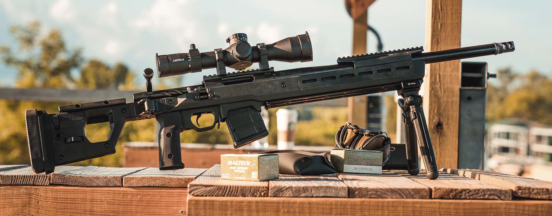 Magpul PMAG 10 5.56 AC in Magpul Pro 700 Stock outdoors on a bench at the range