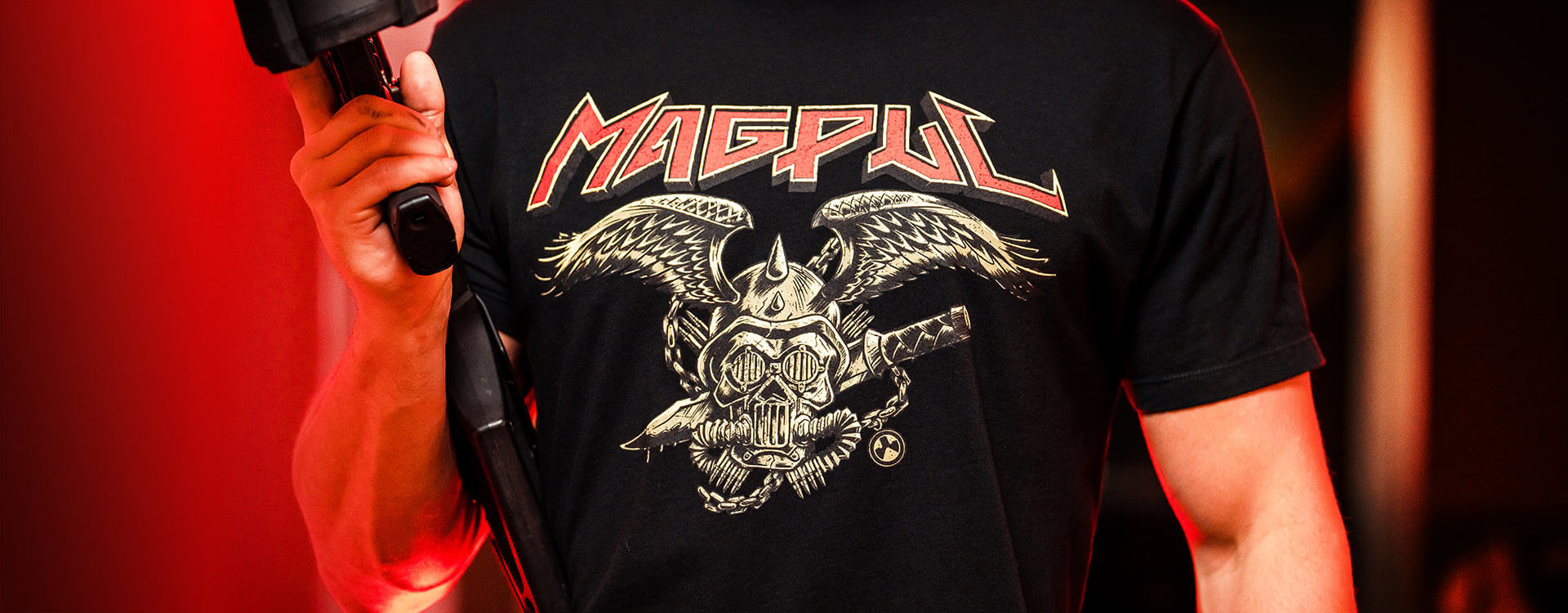 Magpul Heavy Metal Cotton T-Shirt with wicked graphic on man holding AR15 with D-60 Drum PMAG